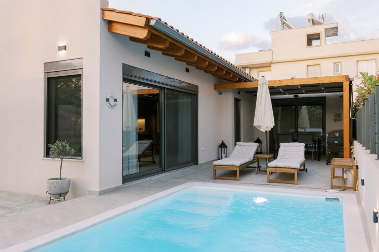 Outdoor pool at Odysseas Seaside Escape