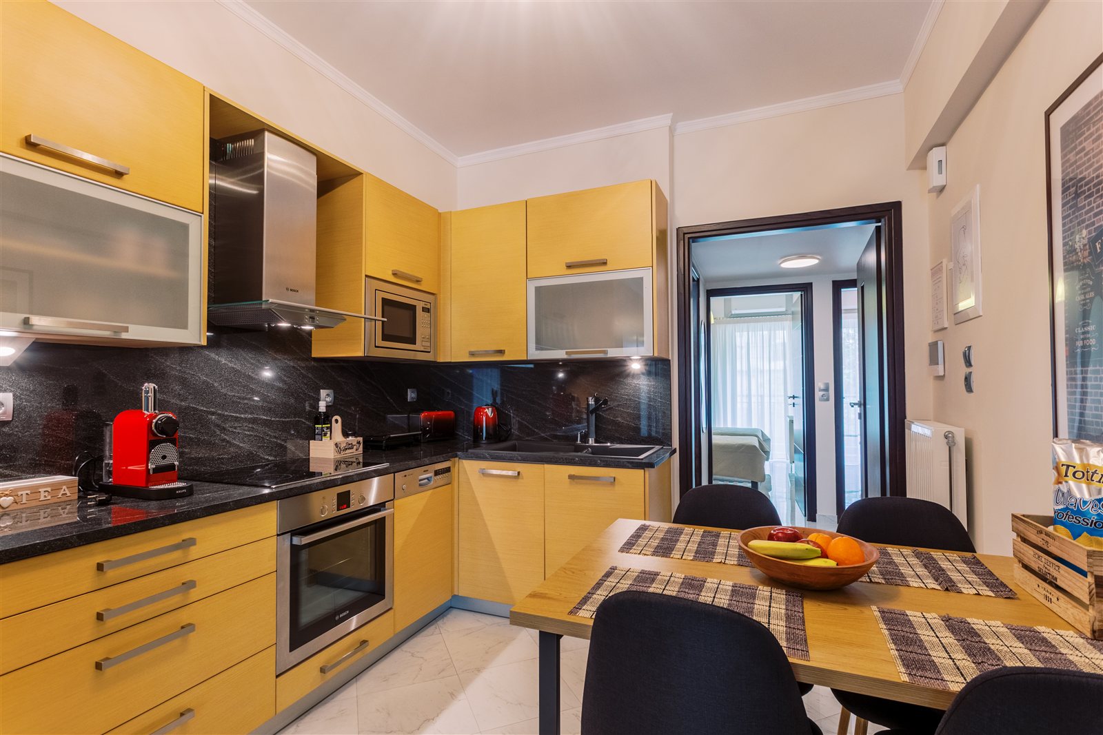 Kitchen and dining area at Gaia Apartment