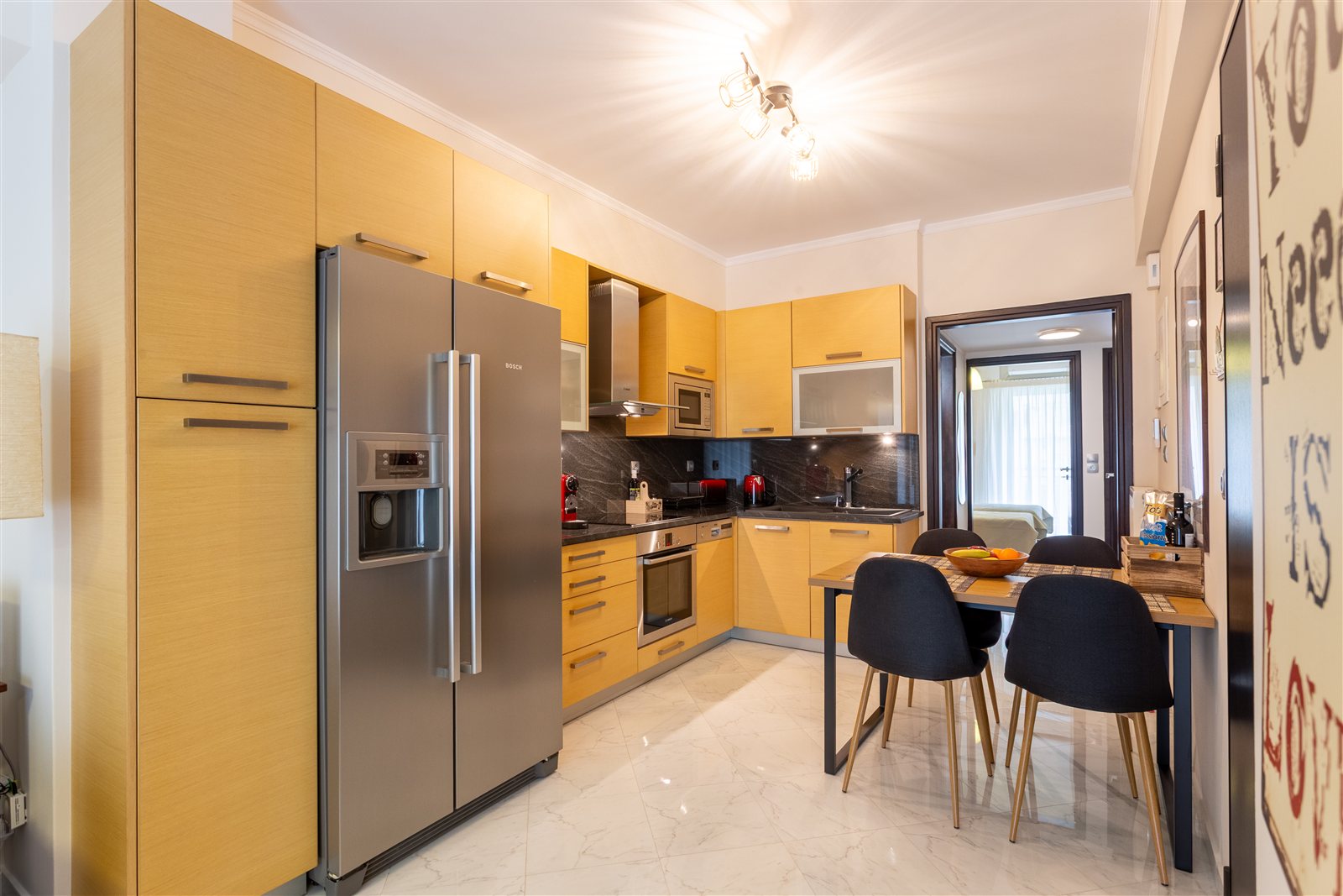 Kitchen and dining area at Gaia Apartment