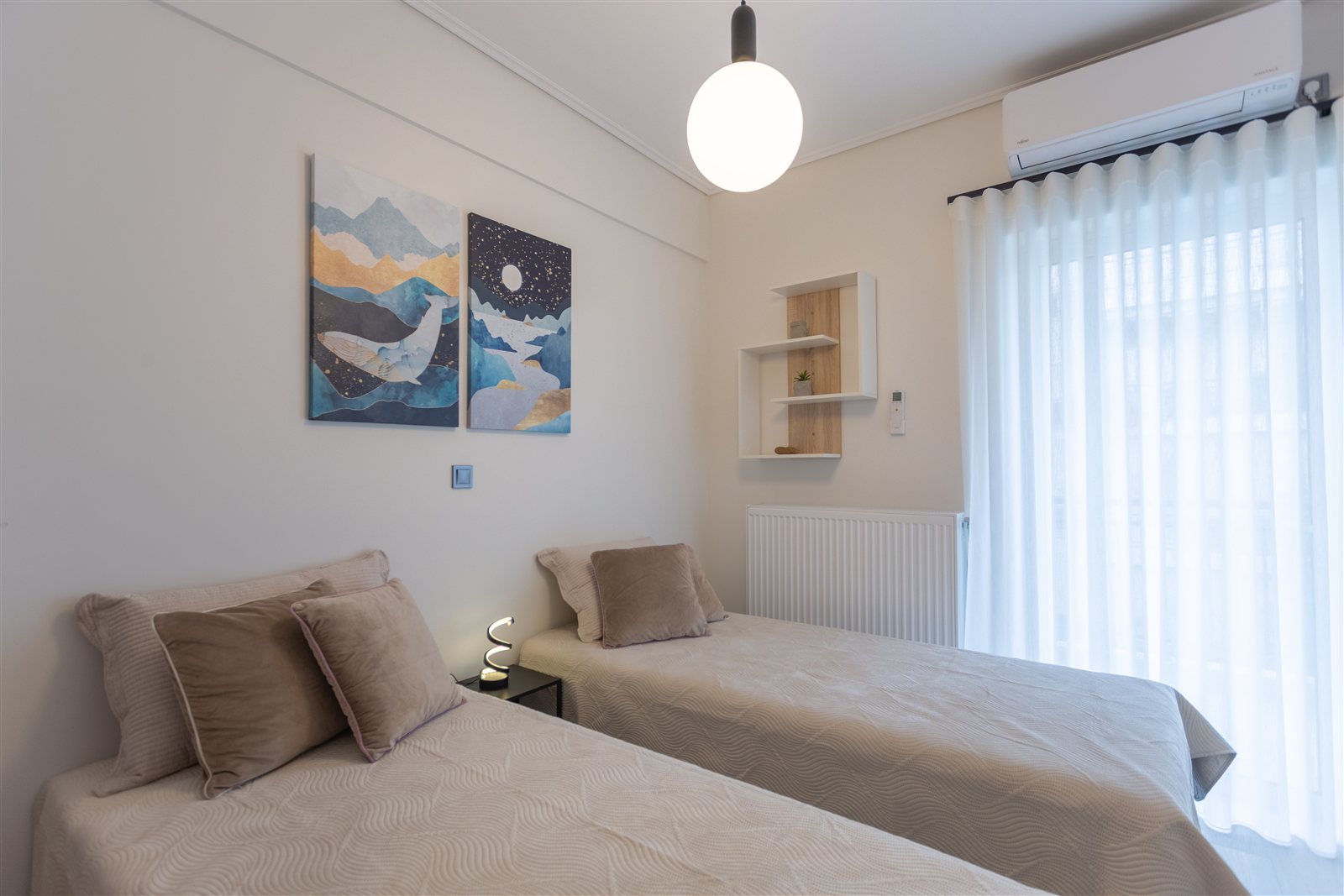 Twin bedroom at Helios Apartment