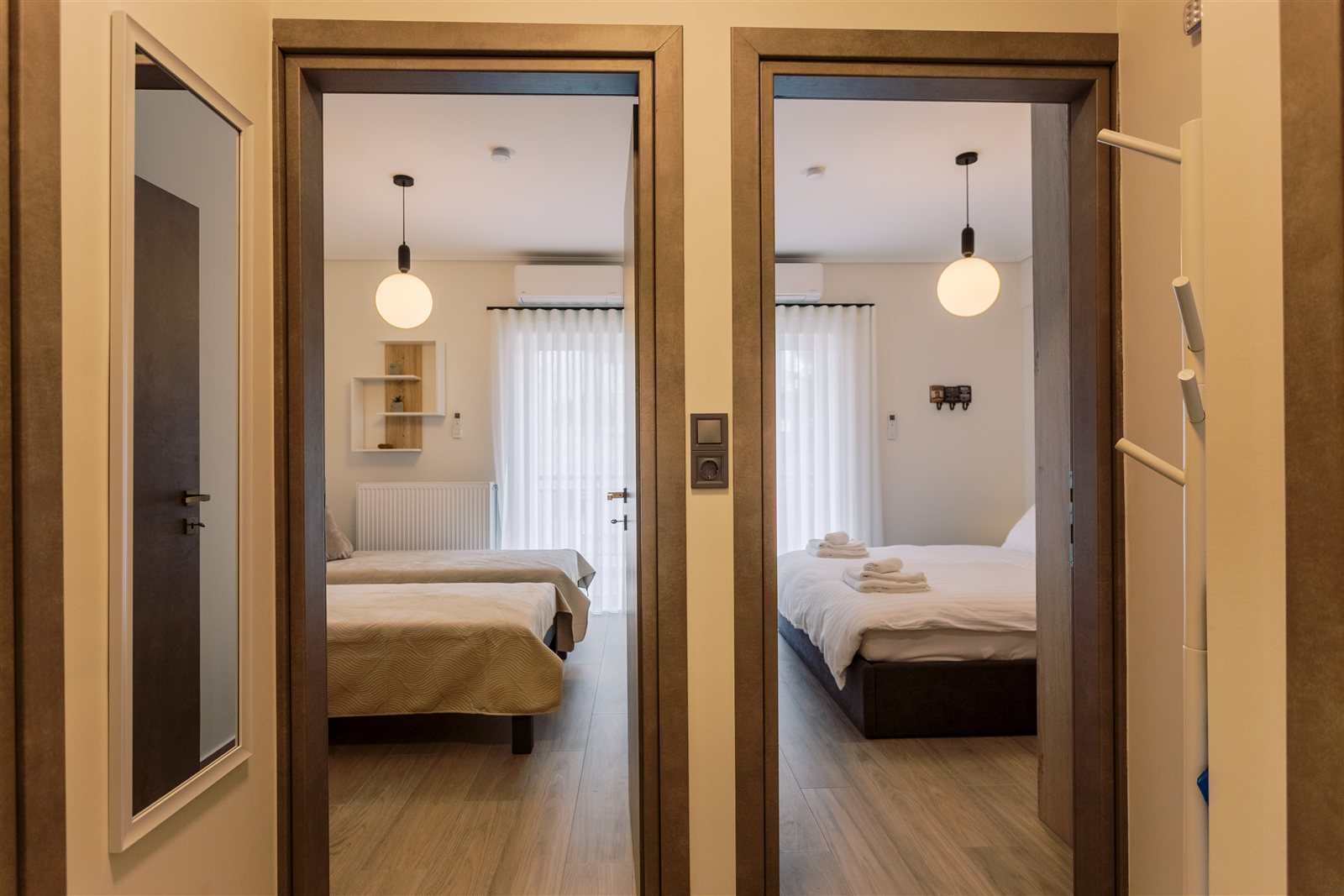 Hallway and bedrooms at Helios Apartment