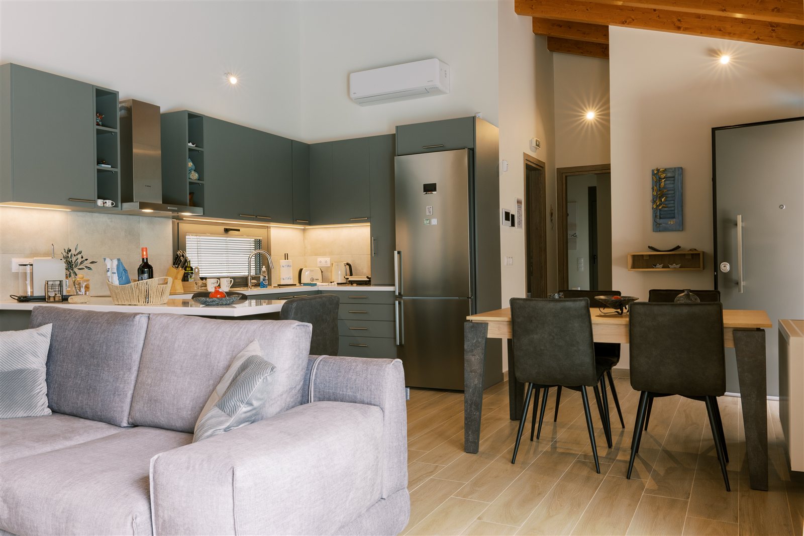Living area and kitchen at Odysseas Seaside Escape