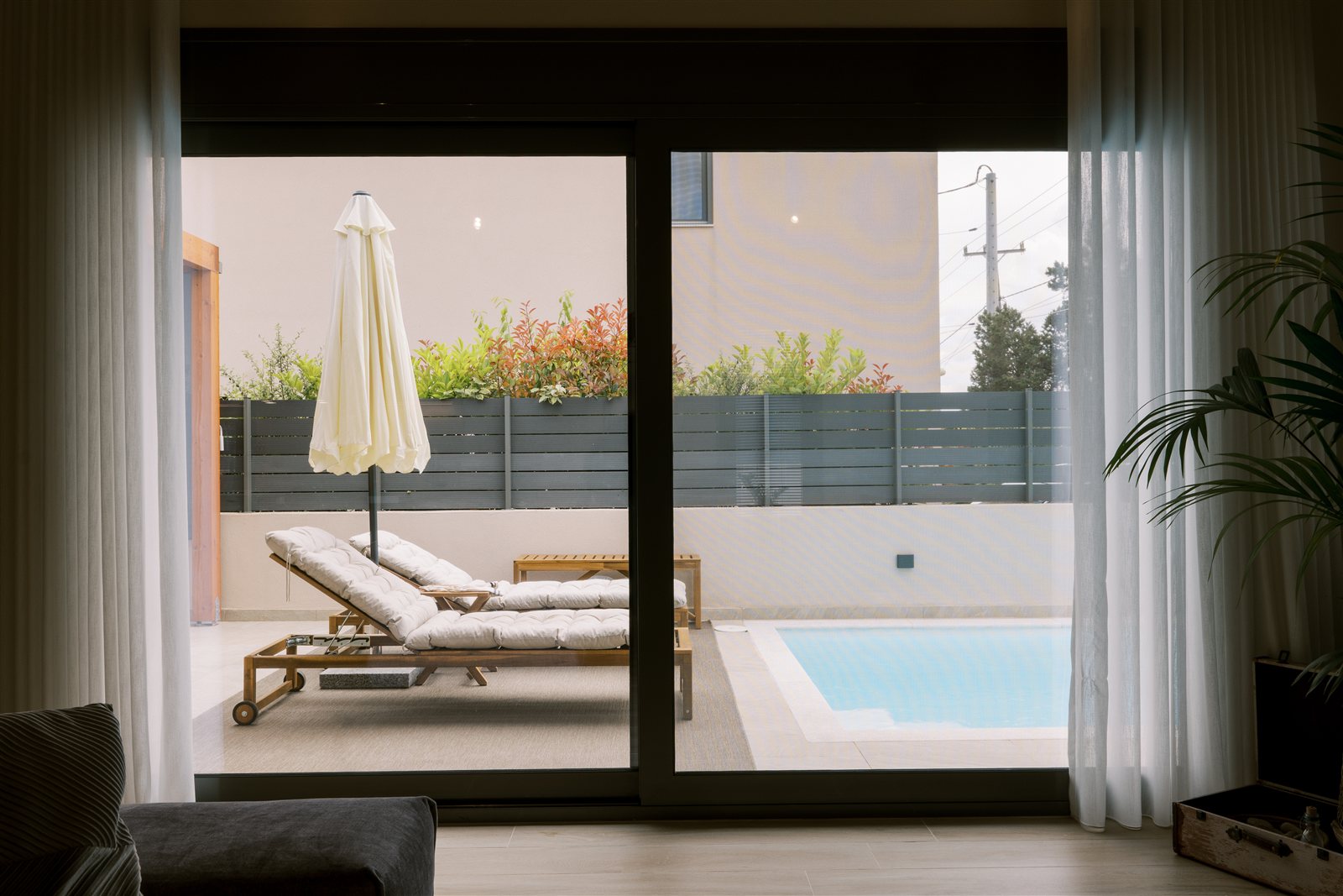 View towards terrace and pool at Odysseas Seaside Escape