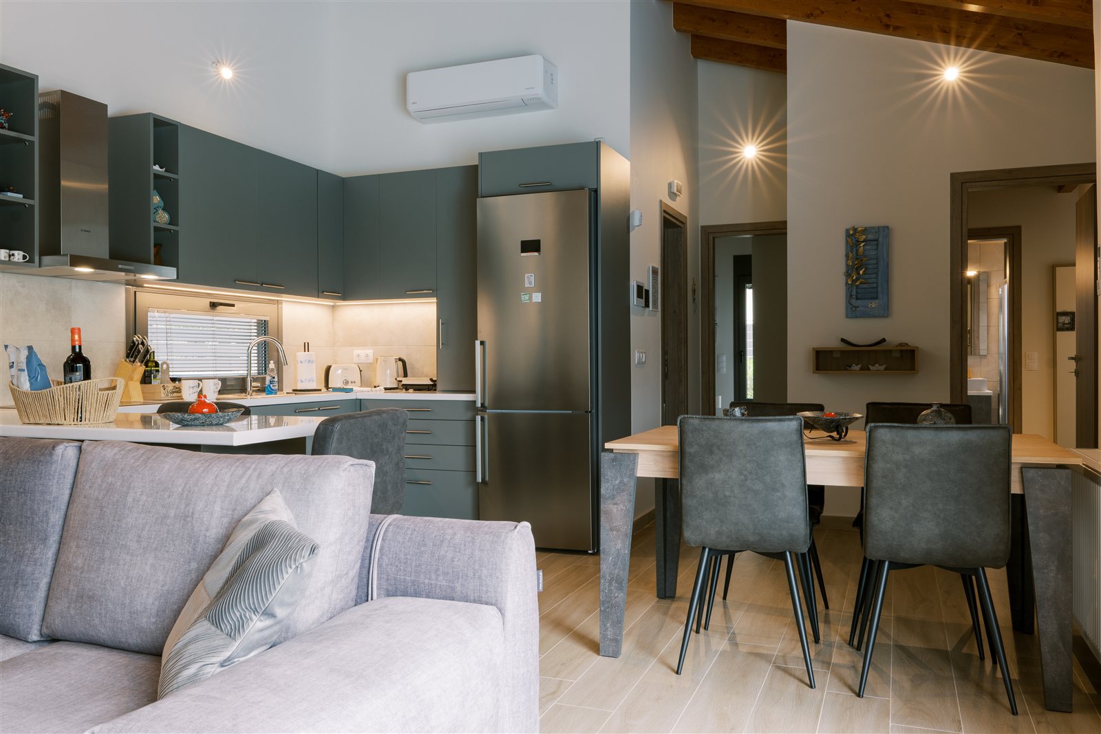 Kitchen and living area at Odysseas Seaside Escape
