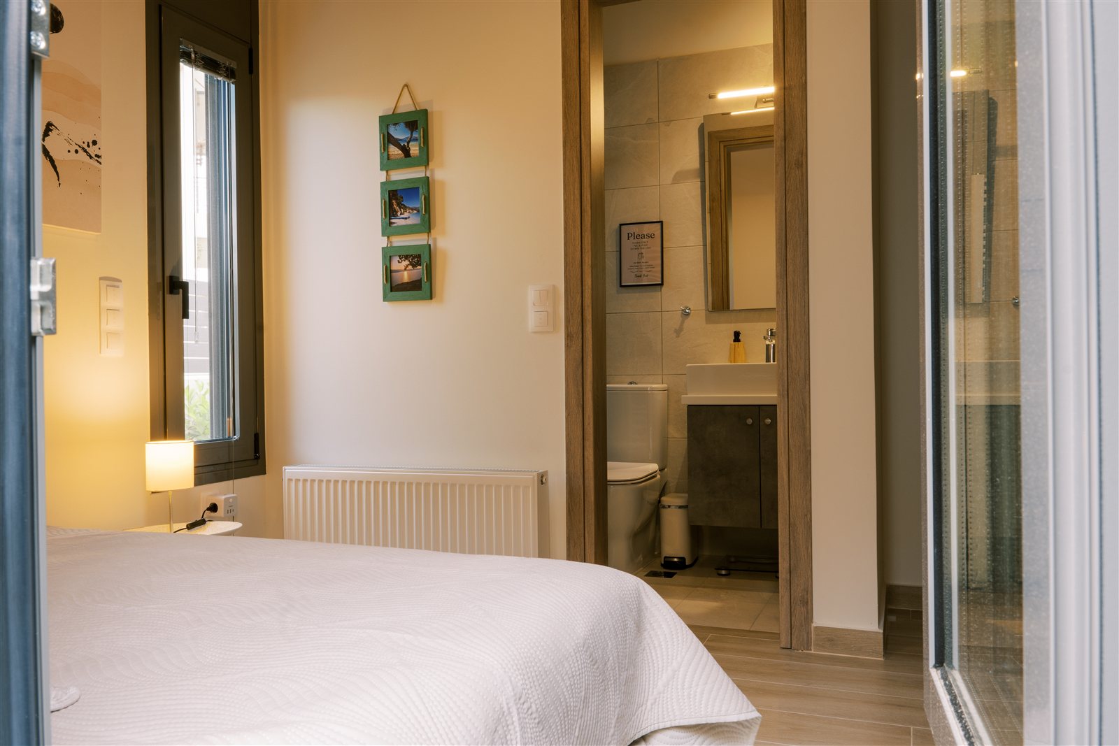 Bedroom and bathroom at Odysseas Seaside Escape