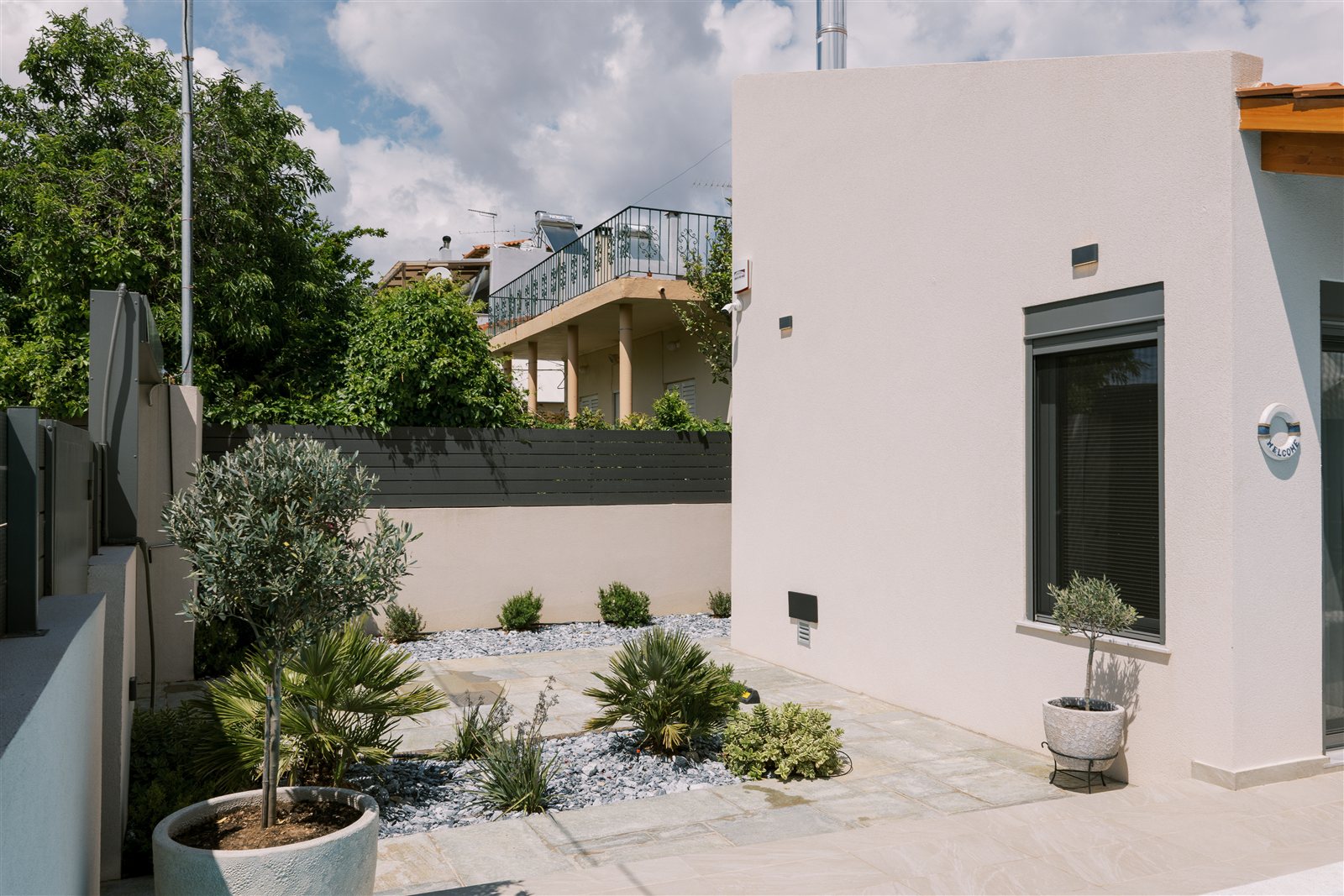 Garden and entrance at Odysseas Seaside Escape