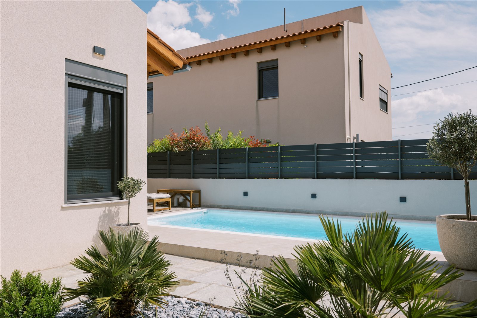 Pool and terrace at Odysseas Seaside Escape