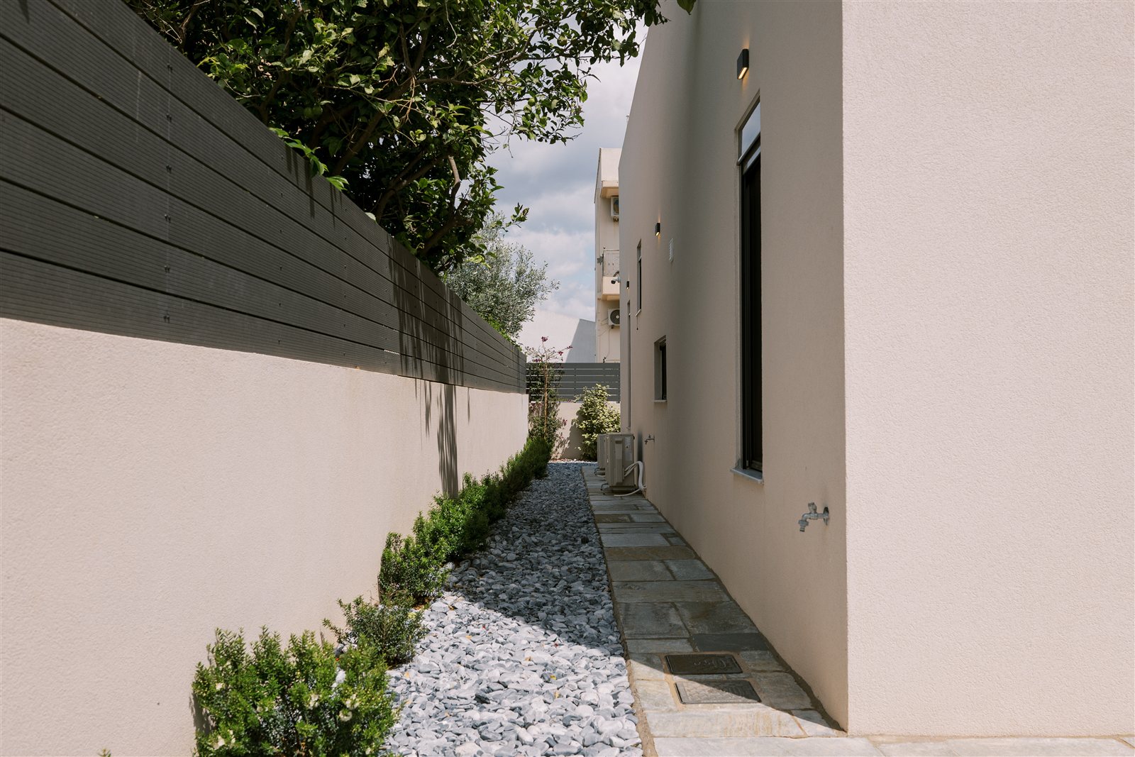 Side garden path at Odysseas Seaside Escape