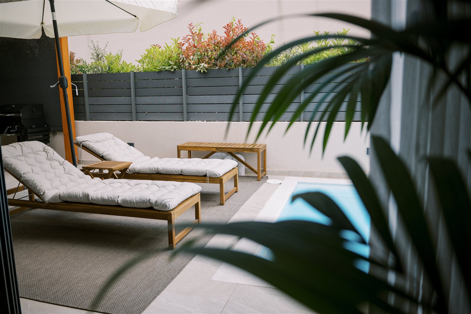 Poolside seating at Odysseas Seaside Escape
